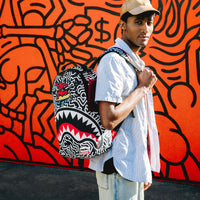 SPRAYGROUND® BACKPACK KEITH HARING SKATER GUY DLXSR BACKPACK